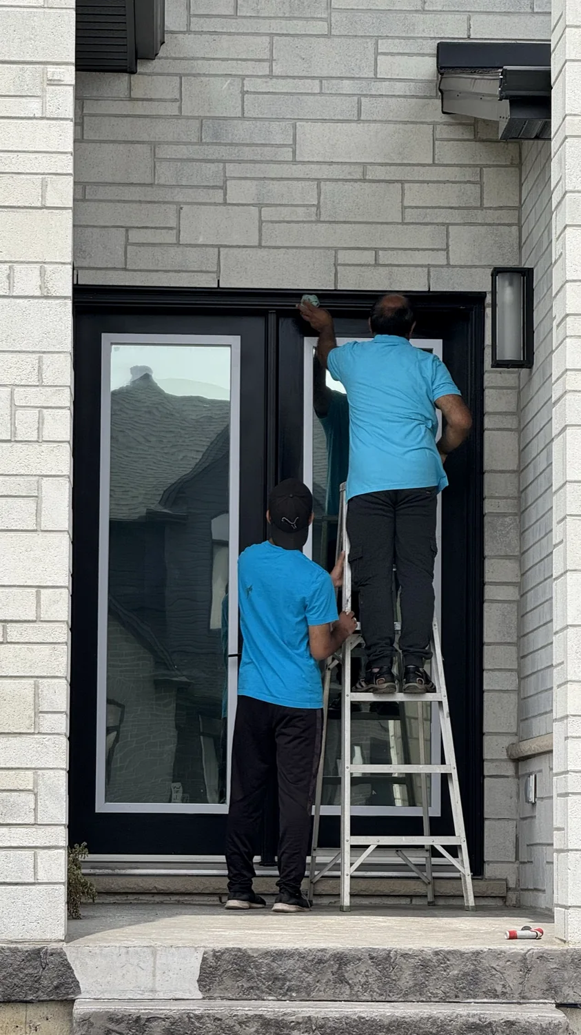 Window cleaning work at a residential entry door